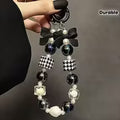Elegant Black and White Electroplated Beaded Bow Keychain with Pearl and Crystal Accents - Durable ABS Material — view 1